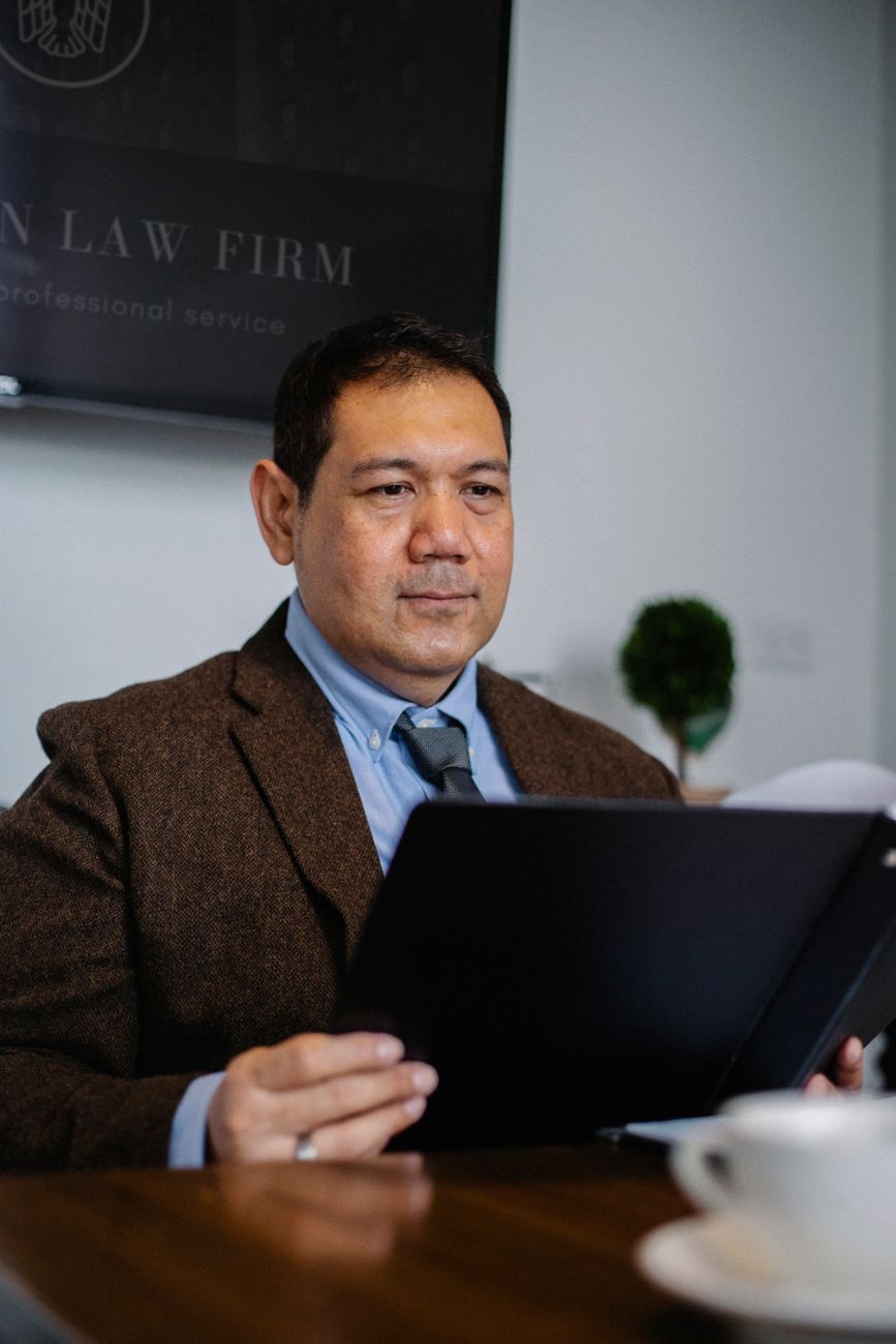 GcorpLex premium office atmosphere with legal consultants discussing and analyzing risk